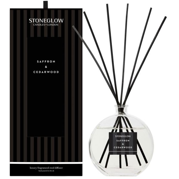 Modern Classics Saffron & Cedarwood Reed Diffuser: a 460ml blend of rich saffron and cedarwood with golden mimosa, lasting up to 32 weeks.